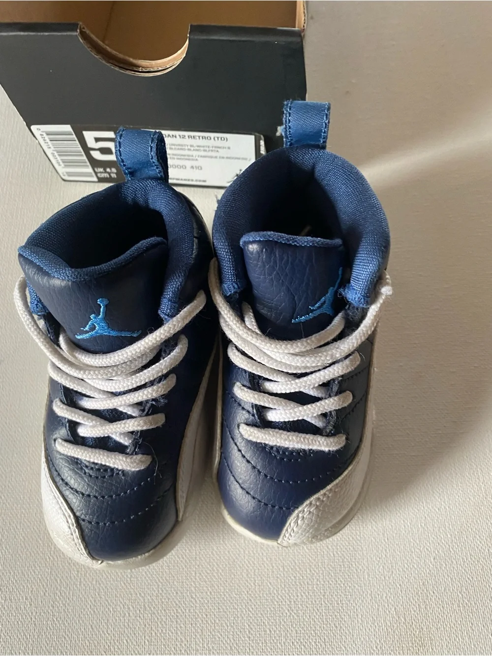 Nike Kids Navy and White Jordan 12’s